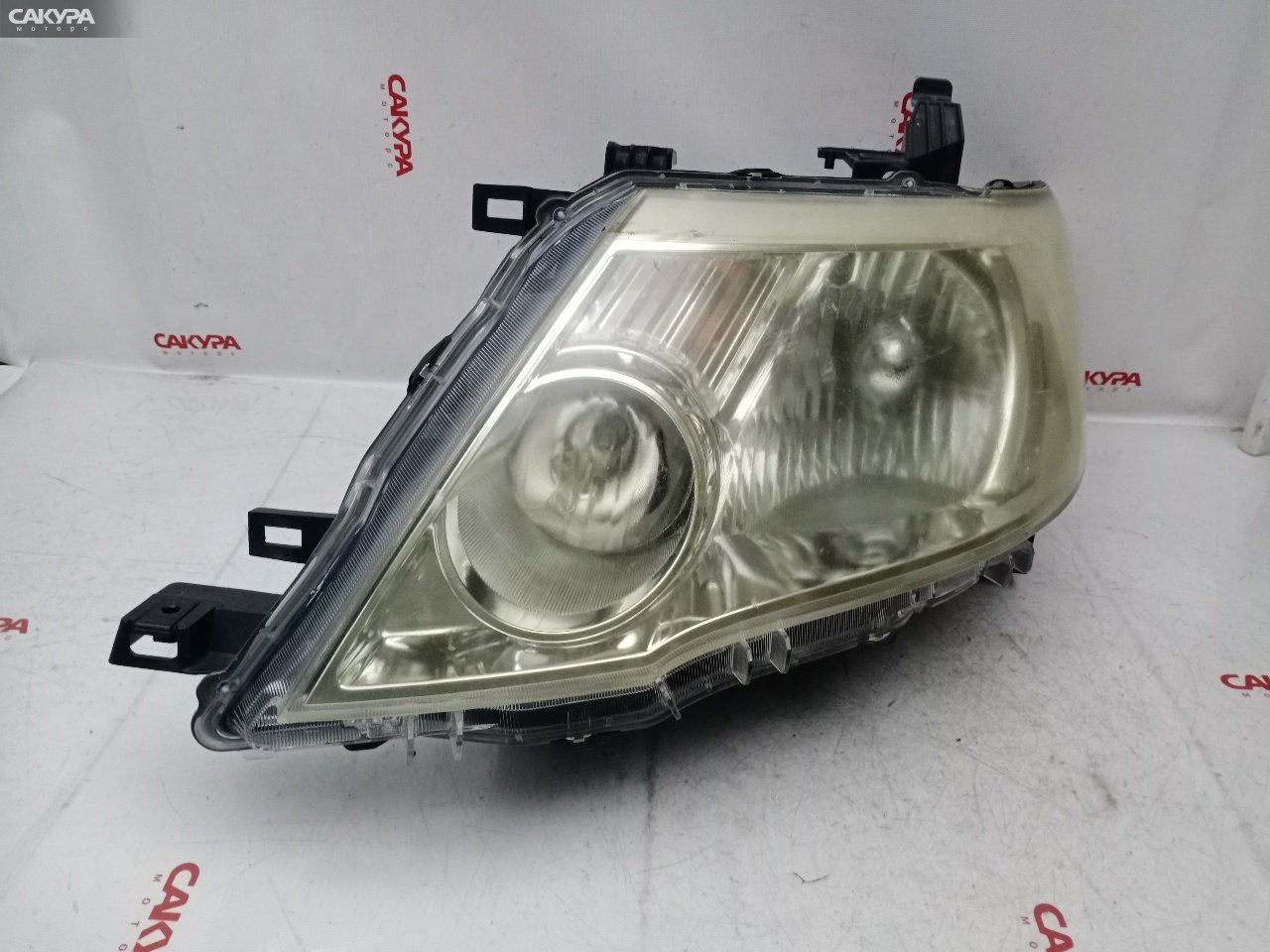 Фара левая Nissan Serena NC25 MR20DE 100-24920: купить в Сакура Красноярск.