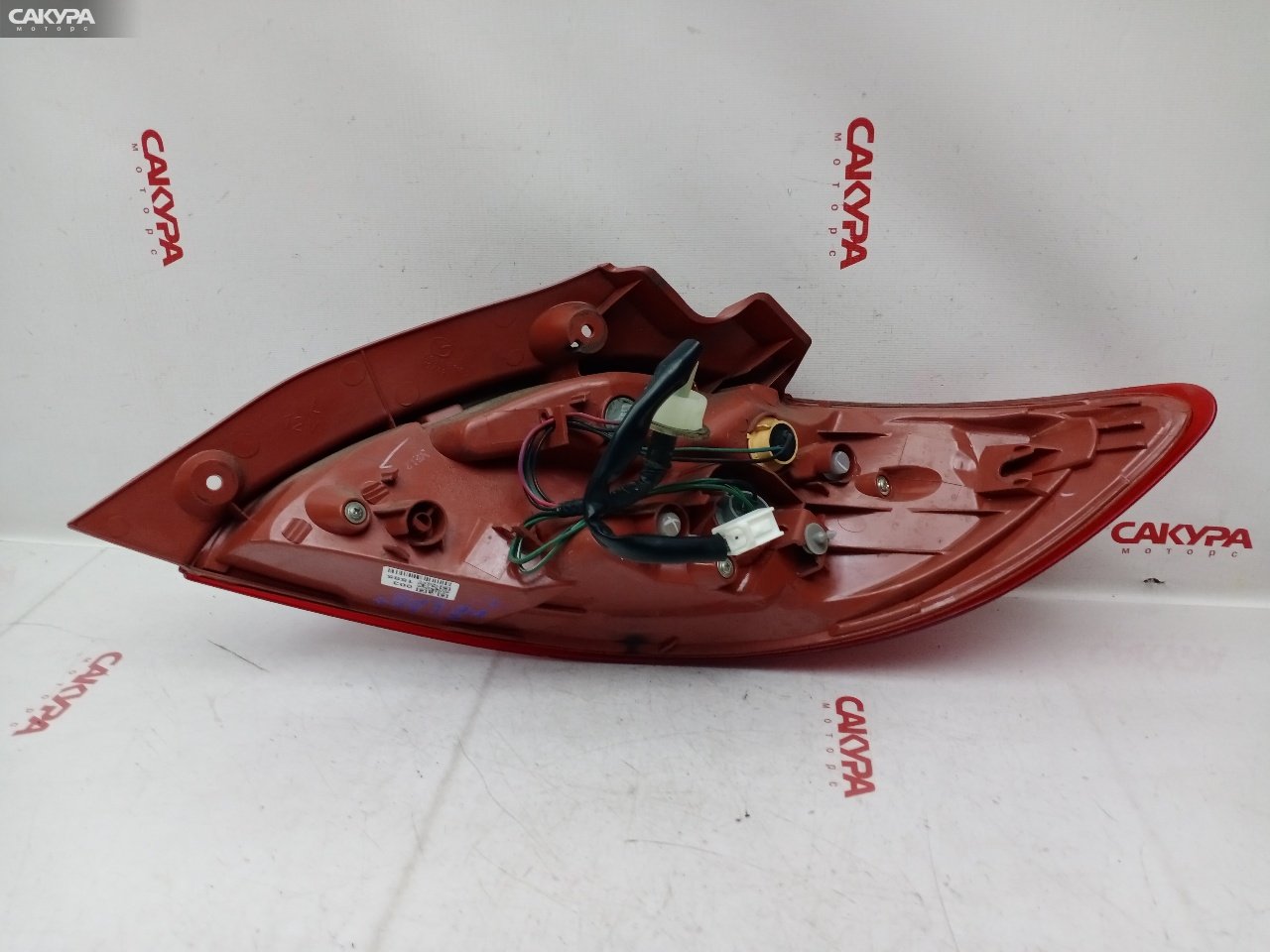 Фонарь стоп-сигнала левый Mazda Demio DE3FS ZJ-VE P5776: купить в Сакура Красноярск.