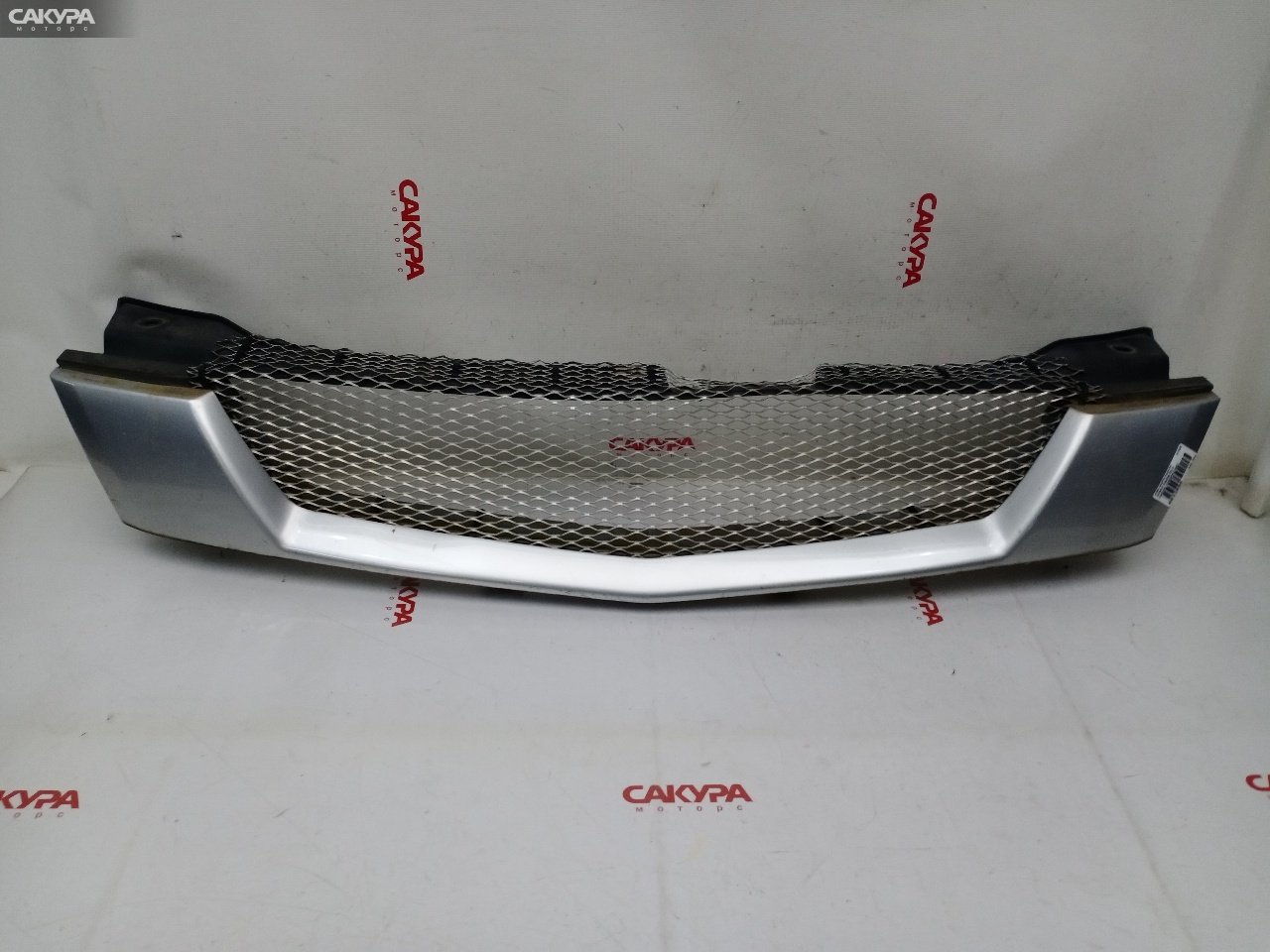 Решетка радиатора Mazda Demio DW3W B3E: купить в Сакура Красноярск.