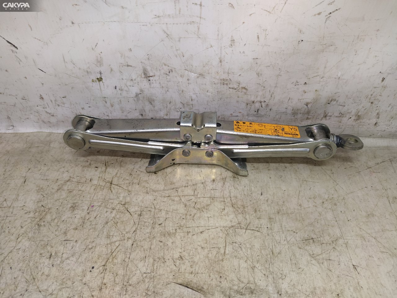 Домкрат Nissan March AK12 CR12DE: купить в Сакура Красноярск.