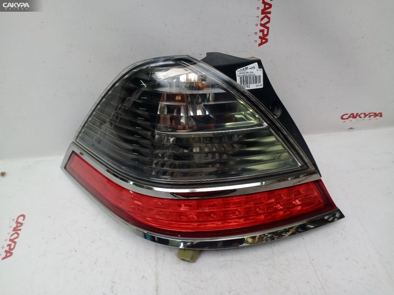 Фонарь стоп-сигнала левый Honda Odyssey RB1 K24A P6572: купить в Сакура Красноярск.