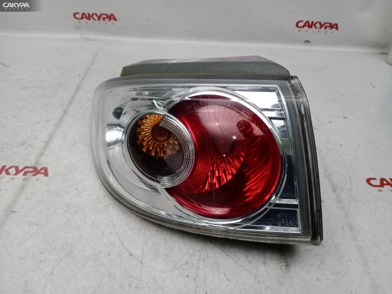 Фонарь стоп-сигнала левый Mazda Demio DY3W ZJ-VE P4419: купить в Сакура Красноярск.