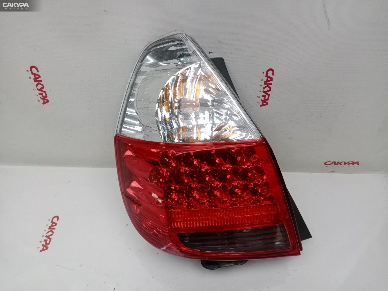 Фонарь стоп-сигнала левый Honda FIT GD1 L13A 4995: купить в Сакура Красноярск.