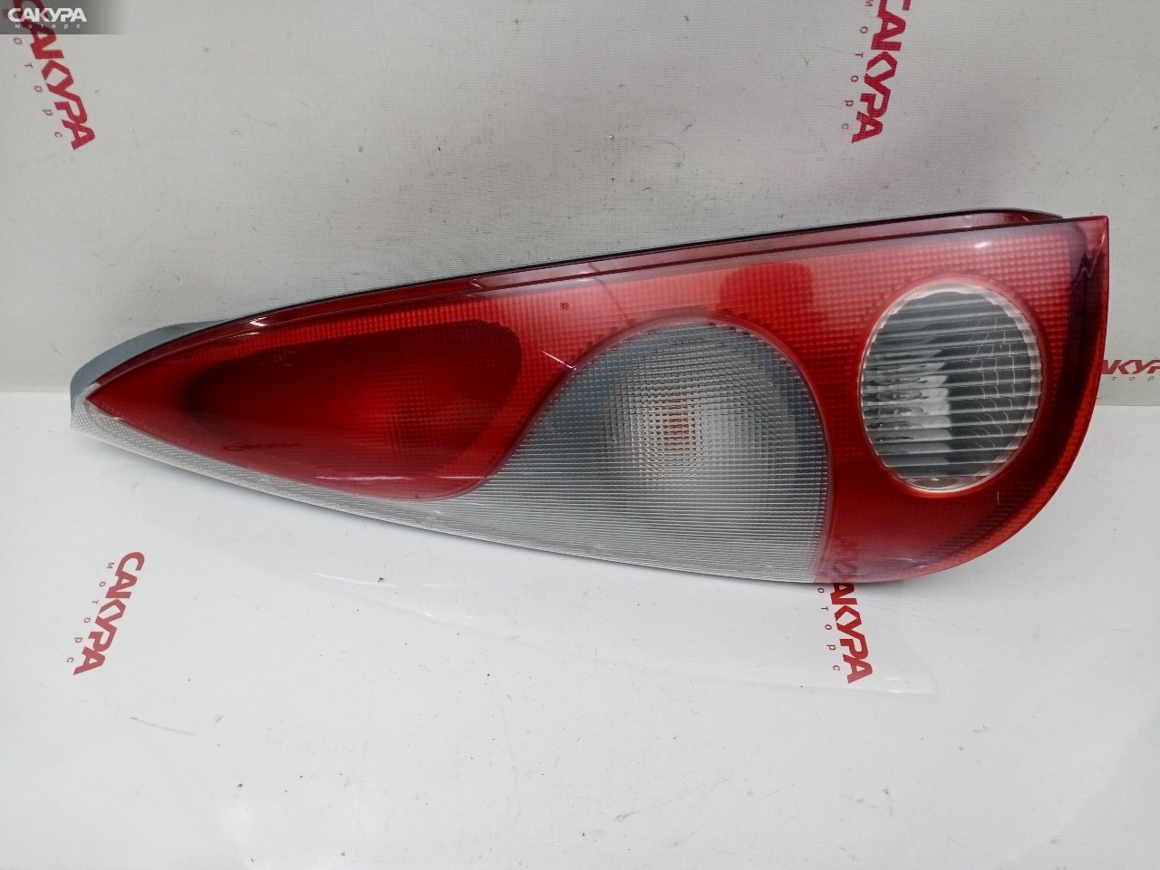 Фонарь стоп-сигнала левый Toyota Funcargo NCP21 1NZ-FE 52-027: купить в Сакура Красноярск.