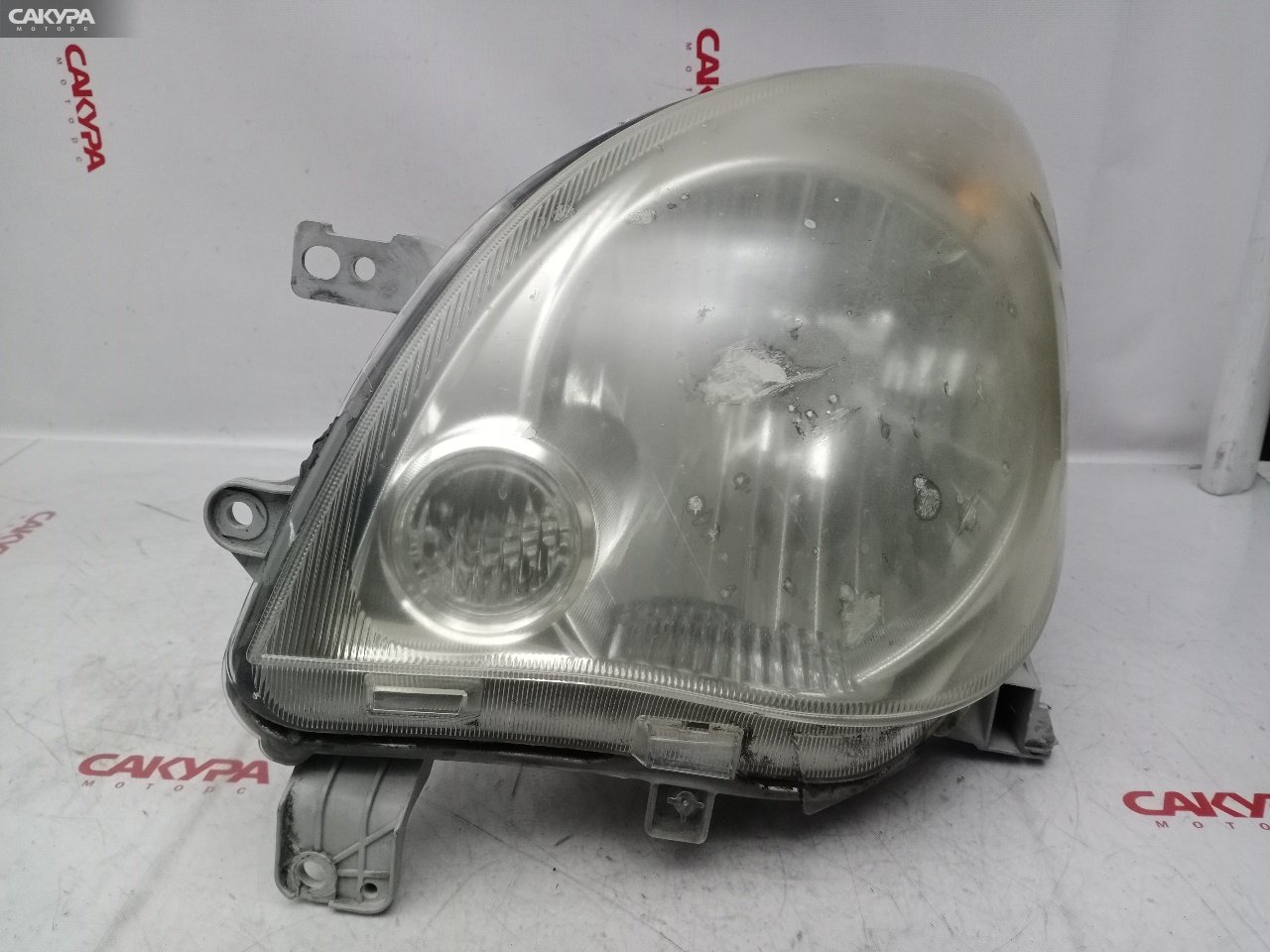 Фара левая Daihatsu Mira L275S KF-VE 100-51870: купить в Сакура Красноярск.