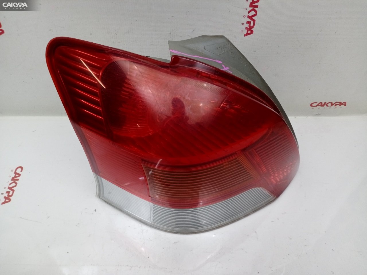 Фонарь стоп-сигнала левый Toyota Vitz KSP90 1KR-FE 52-187: купить в Сакура Красноярск.