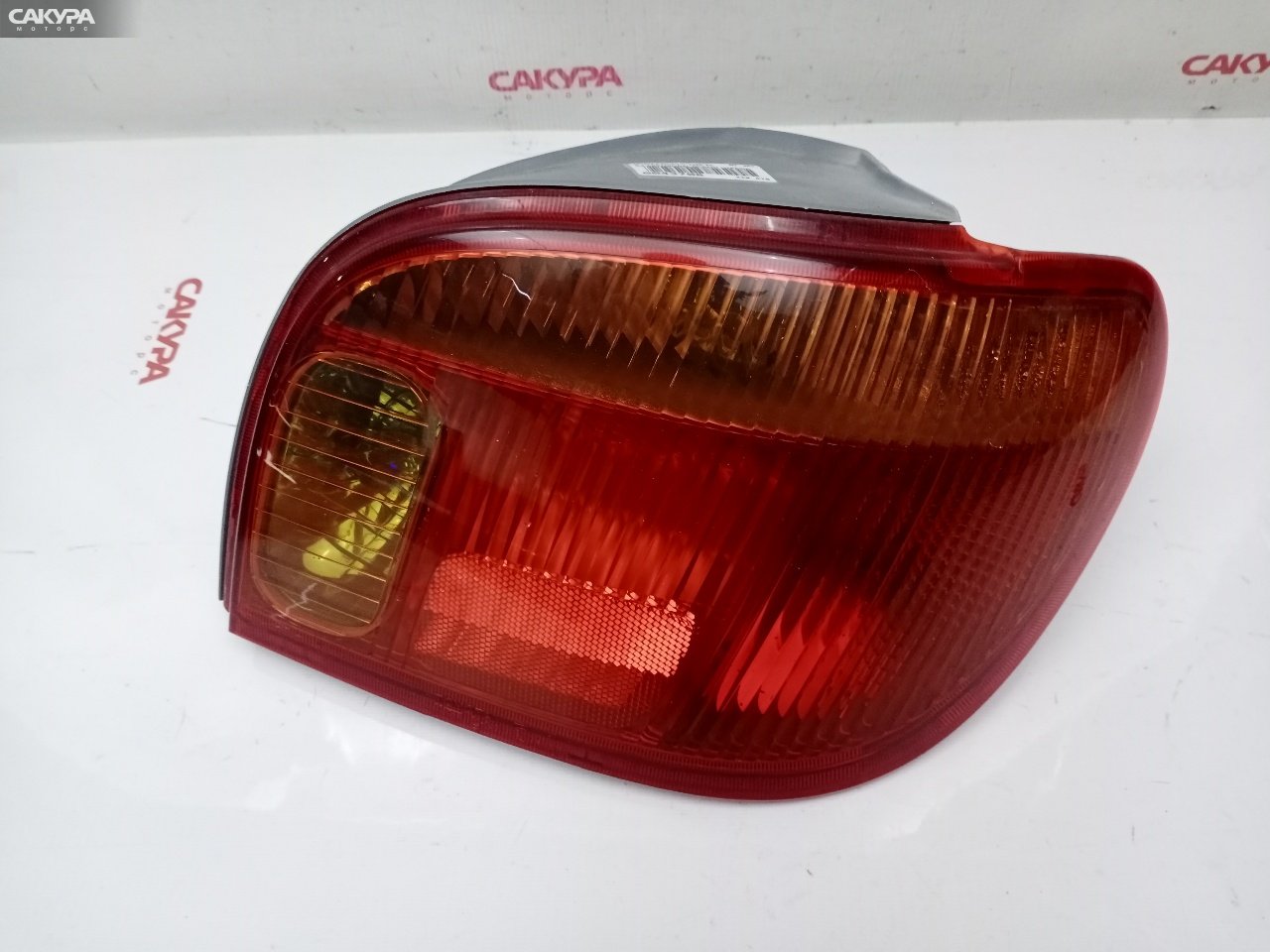 Фонарь стоп-сигнала правый Toyota Vitz NCP15 2NZ-FE 52-049: купить в Сакура Красноярск.