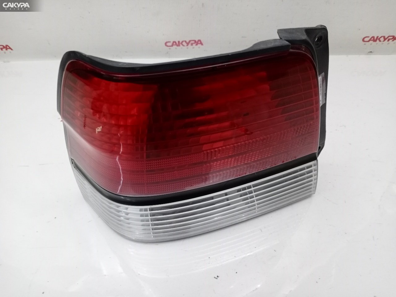 Фонарь стоп-сигнала левый Toyota Tercel EL55 5E-FE 16-162: купить в Сакура Красноярск.