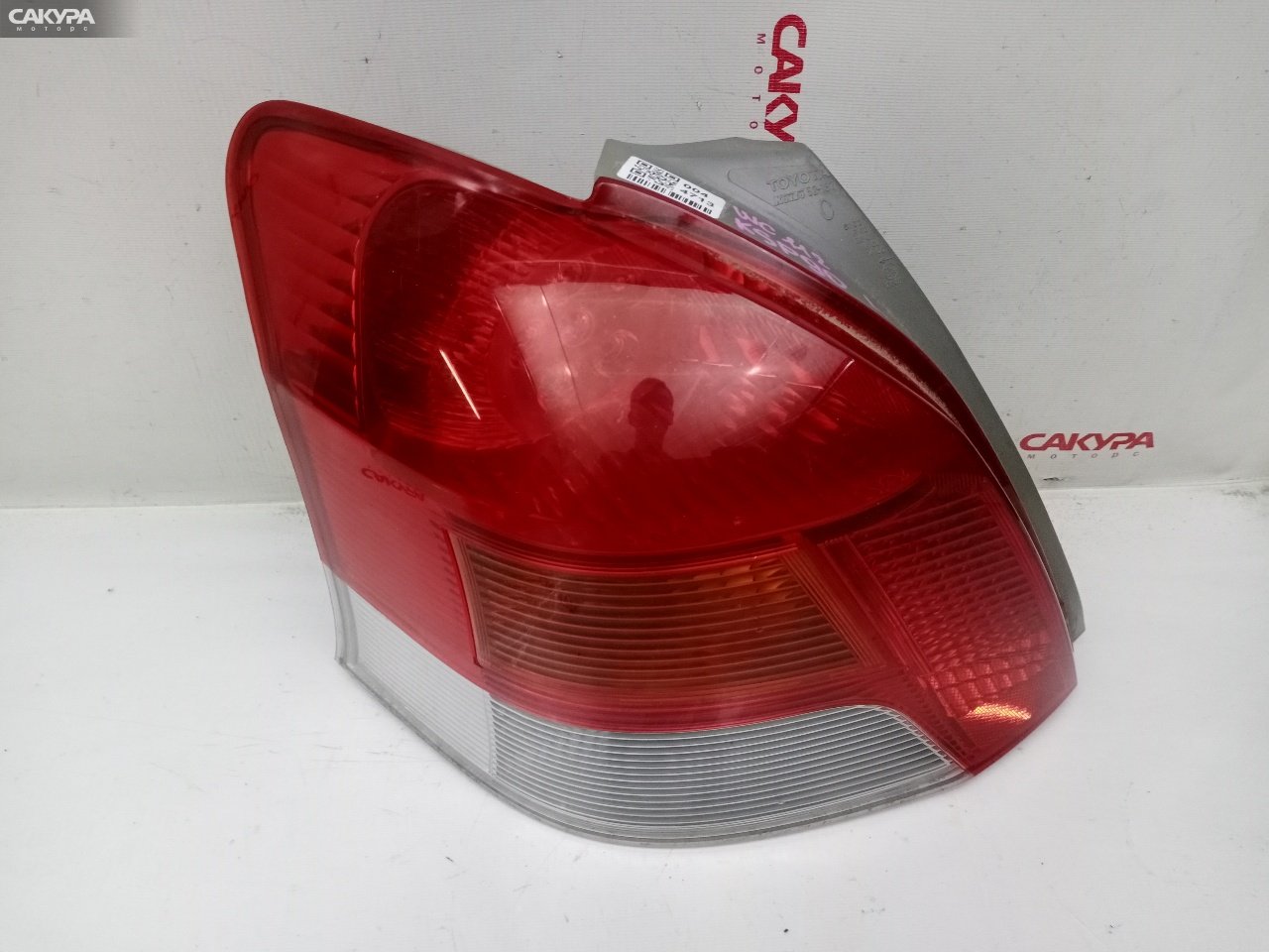 Фонарь стоп-сигнала левый Toyota Vitz KSP90 1KR-FE 52-187: купить в Сакура Красноярск.