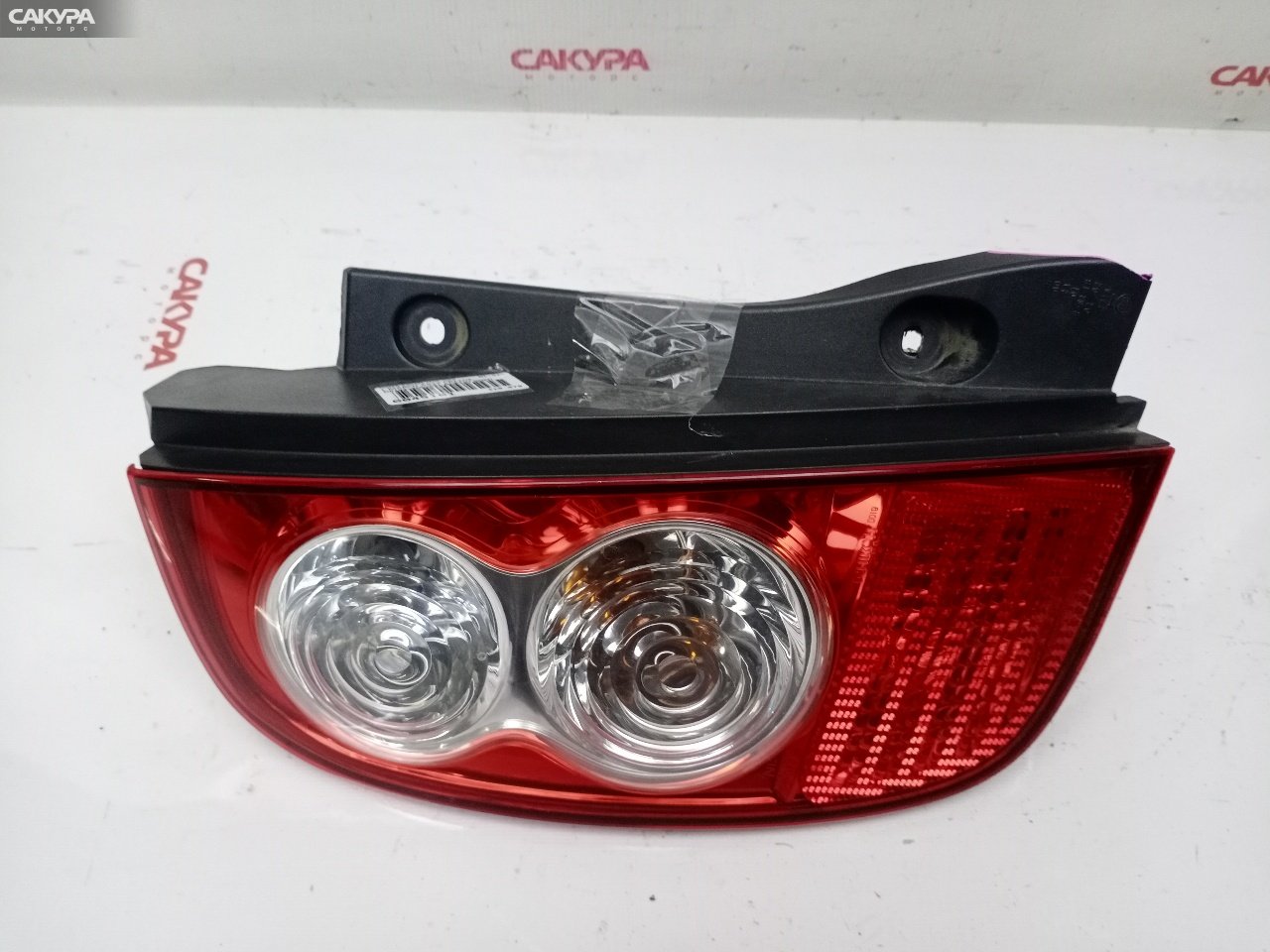 Фонарь стоп-сигнала левый Nissan March AK12 CR12DE D019: купить в Сакура Красноярск.
