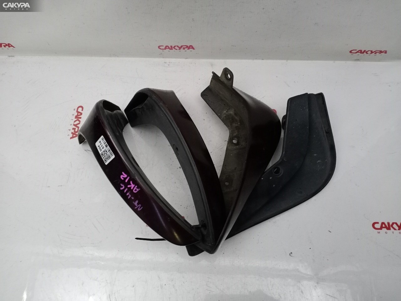 Брызговик Nissan March AK12 CR12DE: купить в Сакура Красноярск.