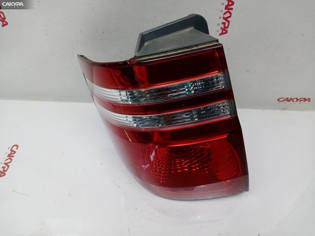 Фонарь стоп-сигнала левый Toyota Alphard MNH10W 1MZ-FE 58-18: купить в Сакура Красноярск.