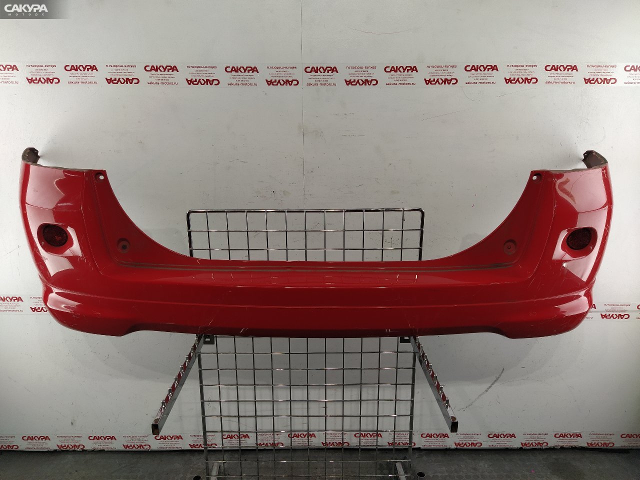 Бампер задний Mazda Demio DY5W ZY-VE: купить в Сакура Красноярск.