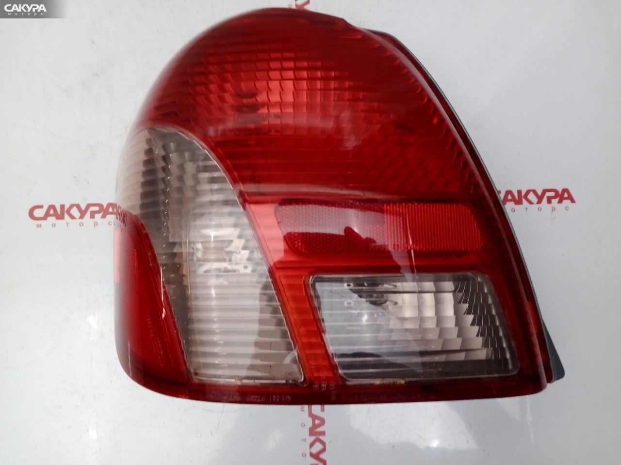 Фонарь стоп-сигнала левый Toyota Platz NCP12 1NZ-FE 52-013: купить в Сакура Красноярск.