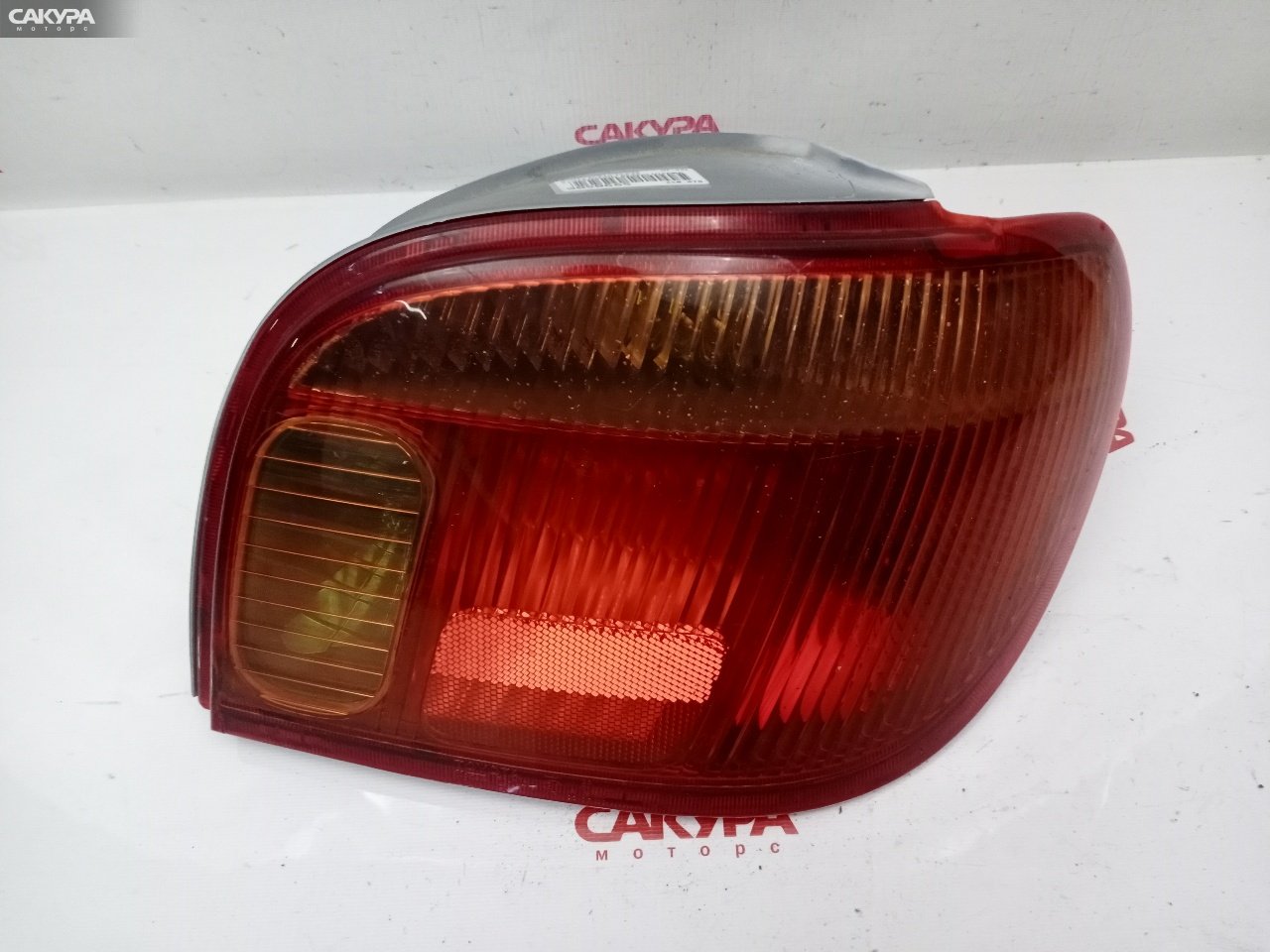 Фонарь стоп-сигнала правый Toyota Vitz SCP10 1SZ-FE 52-049: купить в Сакура Красноярск.