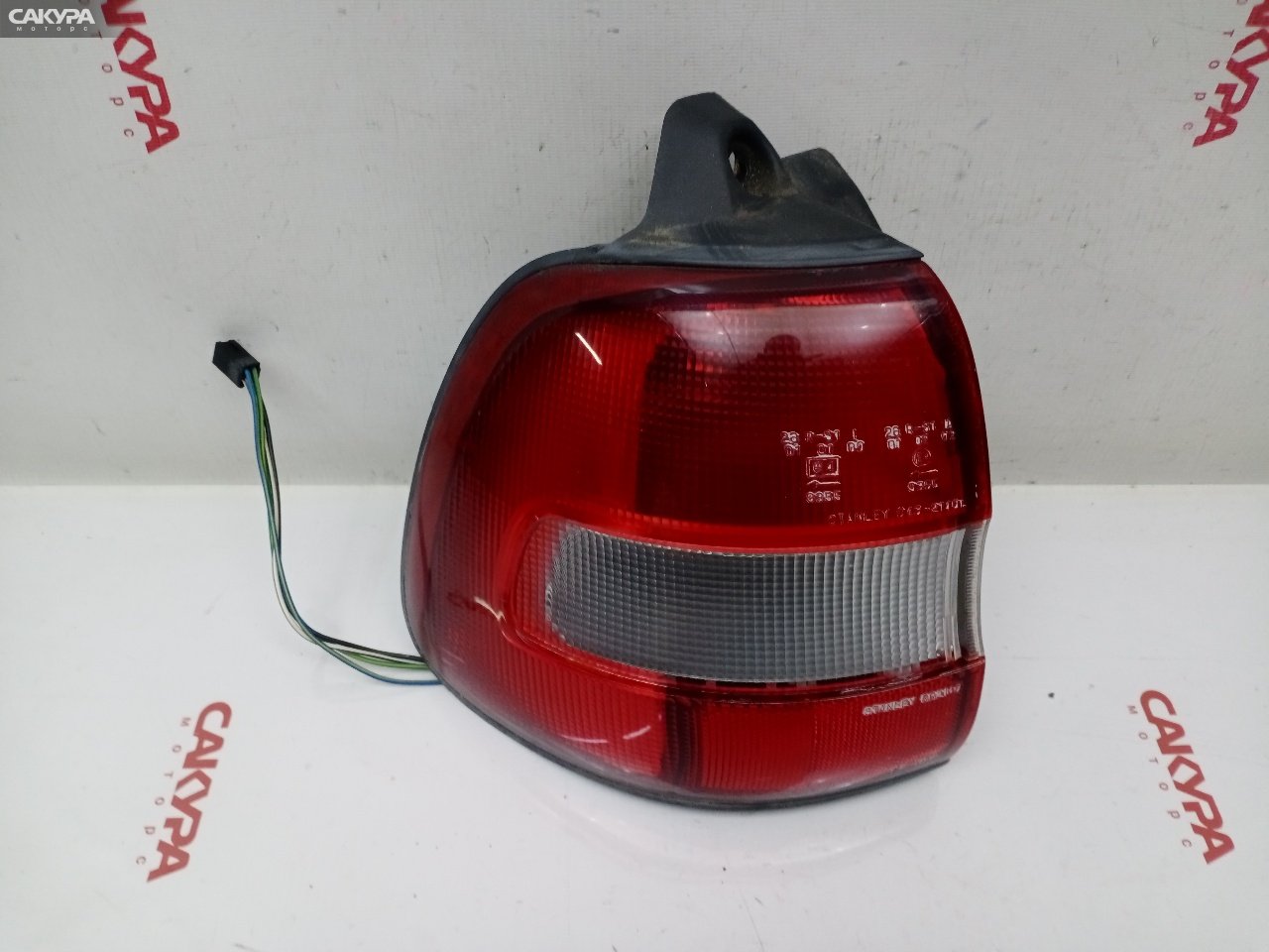 Фонарь стоп-сигнала левый Suzuki Cultus Crescent GC21W G15A 043-2140: купить в Сакура Красноярск.