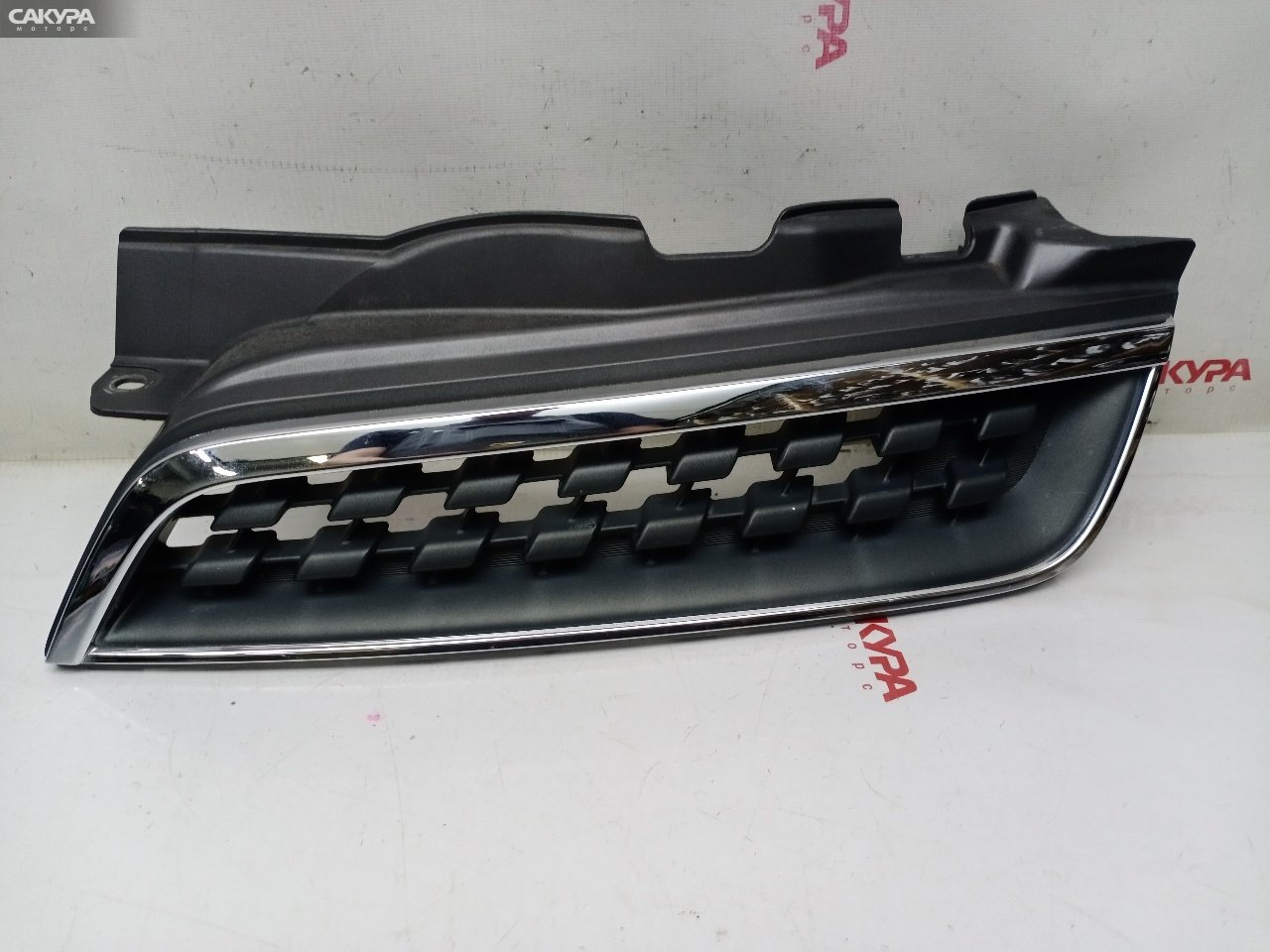 Решетка радиатора левая Nissan March AK12 CR12DE: купить в Сакура Красноярск.