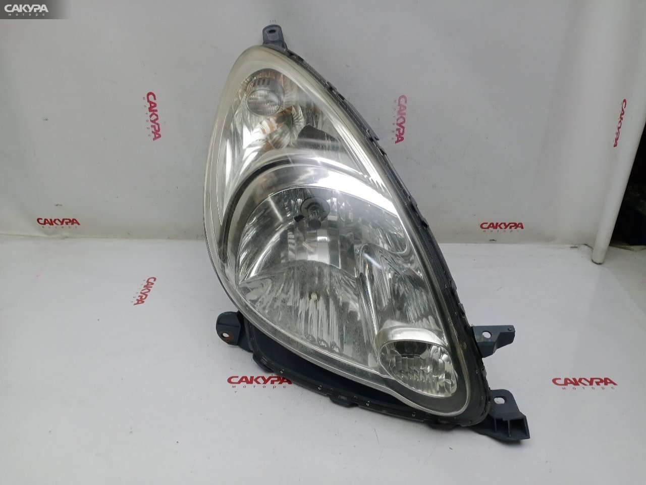 Фара правая Toyota Funcargo NCP20 2NZ-FE 52-088: купить в Сакура Красноярск.
