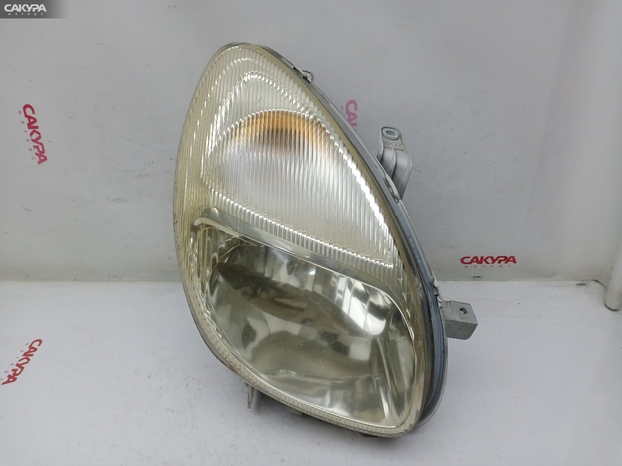 Фара правая Toyota Duet M100A EJ-VE R7368: купить в Сакура Красноярск.