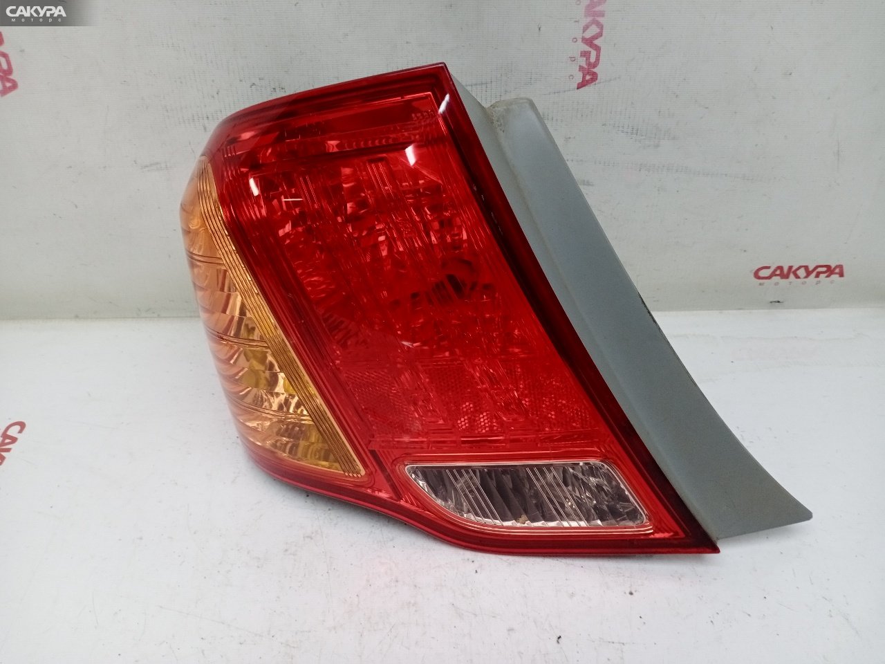 Фонарь стоп-сигнала левый Toyota Corolla Axio ZRE142 2ZR-FE 12-512: купить в Сакура Красноярск.
