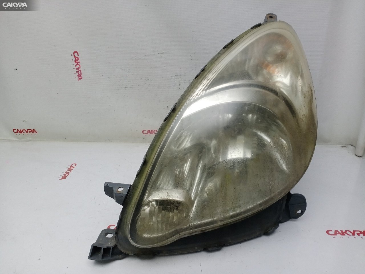 Фара левая Toyota Funcargo NCP20 2NZ-FE 52-088: купить в Сакура Красноярск.