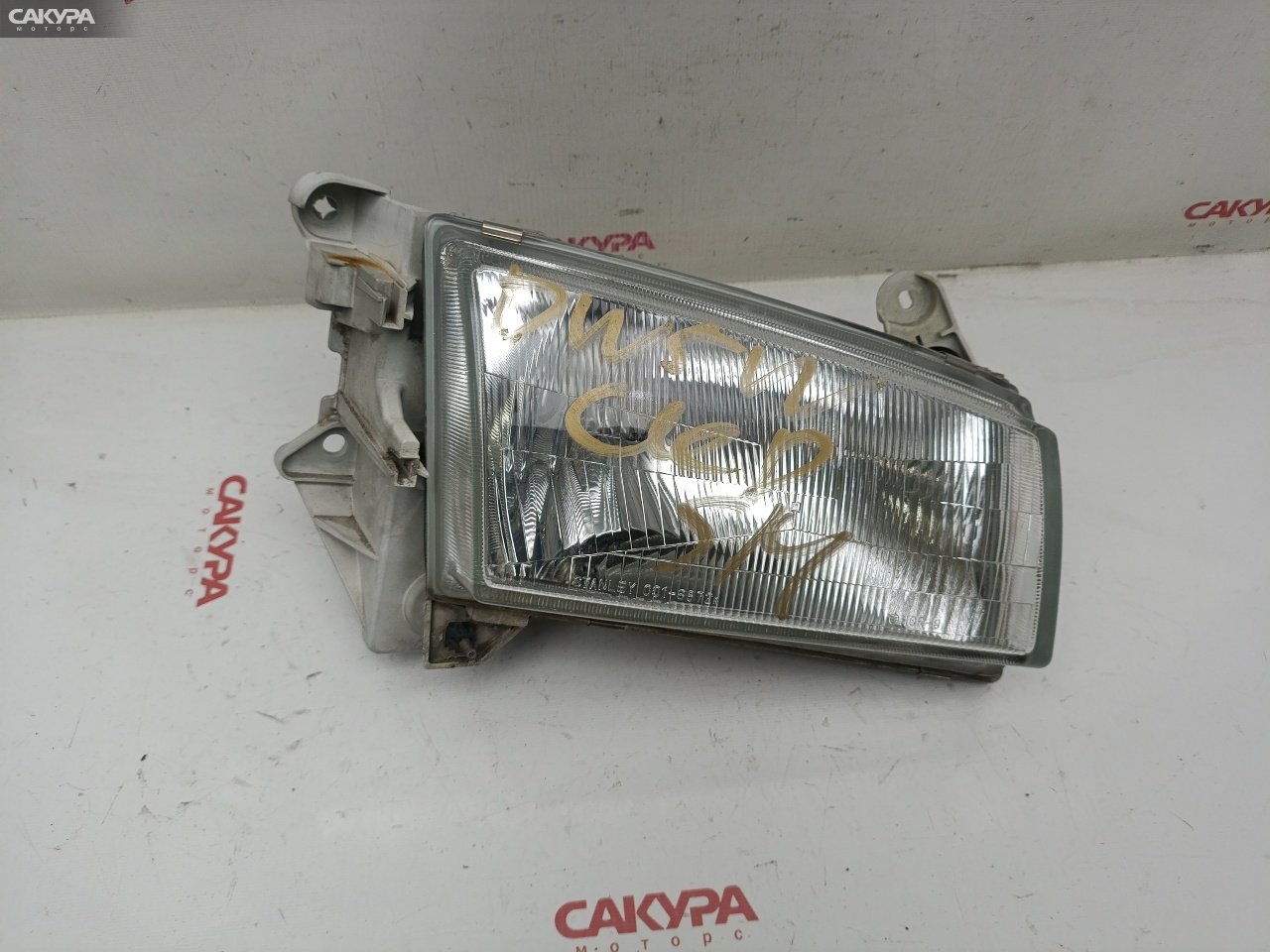 Фара правая Mazda Demio DW5W B5-ME 001-6872: купить в Сакура Красноярск.