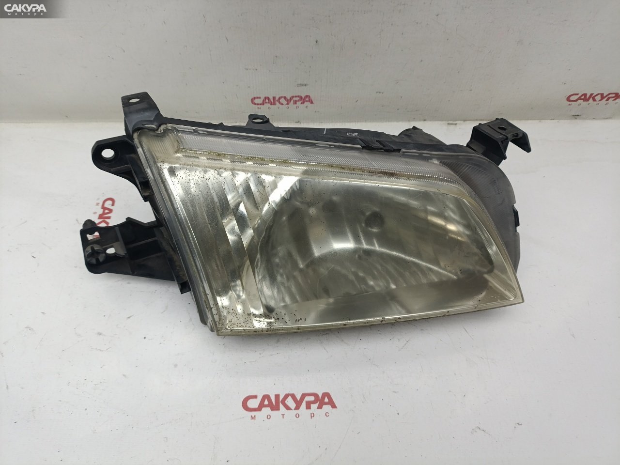 Фара правая Mazda Demio DW3W B3E P1001: купить в Сакура Красноярск.