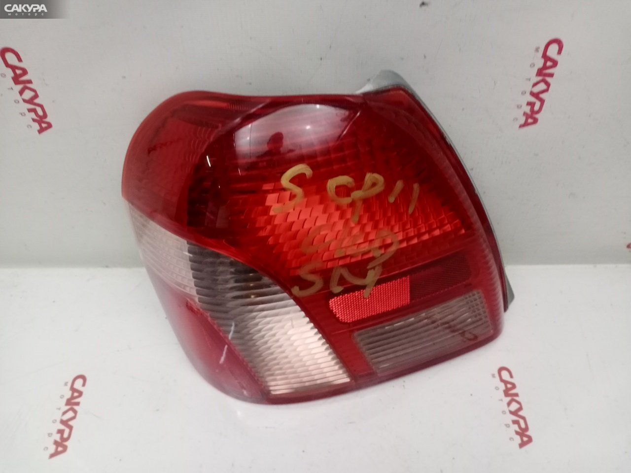 Фонарь стоп-сигнала левый Toyota Platz SCP11 1SZ-FE 52-013: купить в Сакура Красноярск.