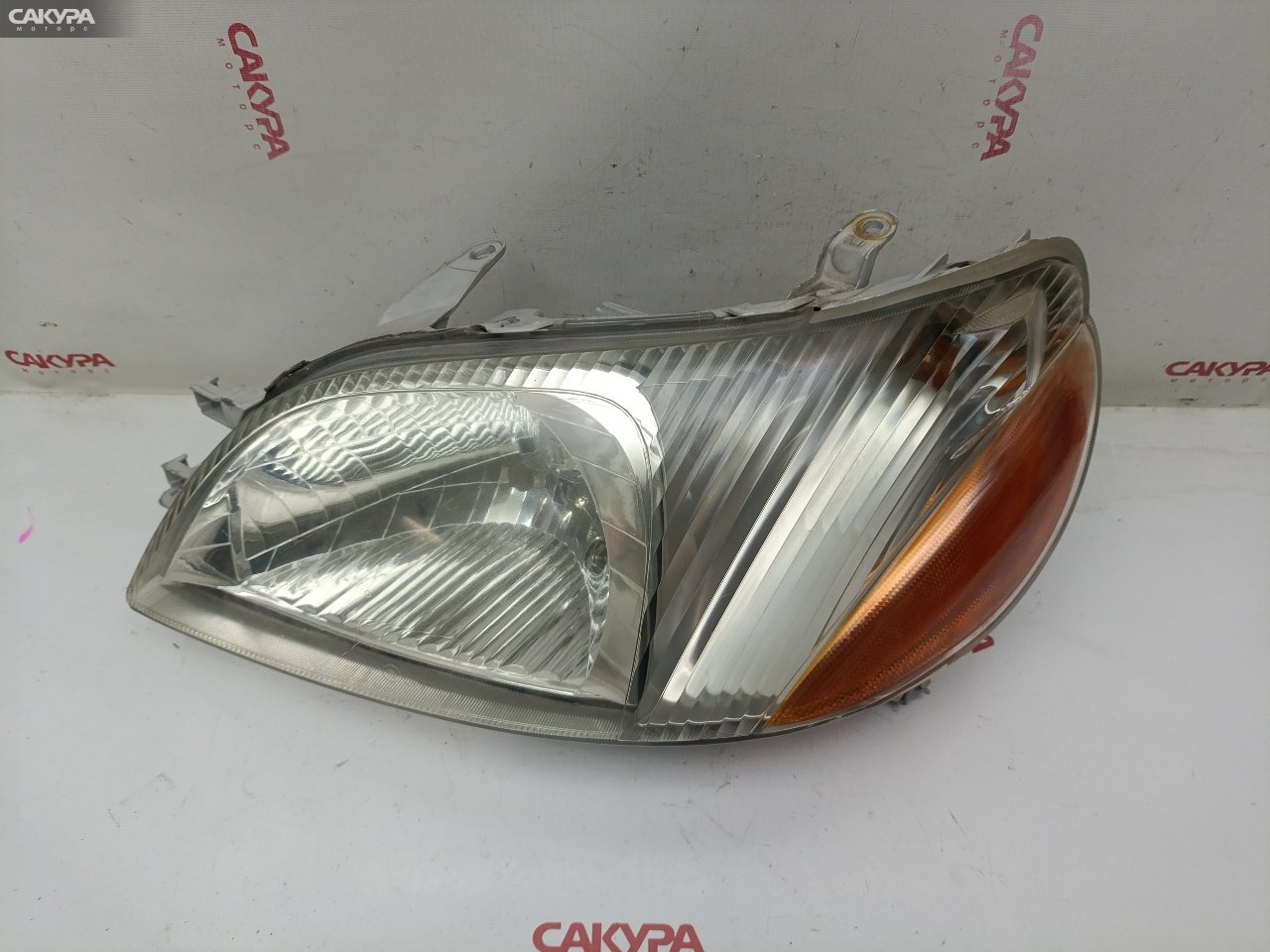 Фара левая Toyota Platz SCP11 1SZ-FE 52-009: купить в Сакура Красноярск.