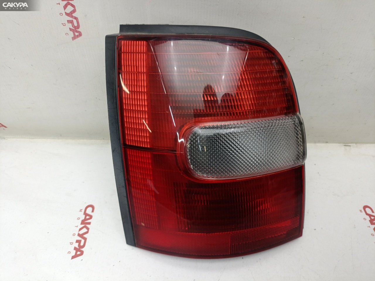 Фонарь стоп-сигнала левый Nissan March K11 CG10DE 4786: купить в Сакура Красноярск.