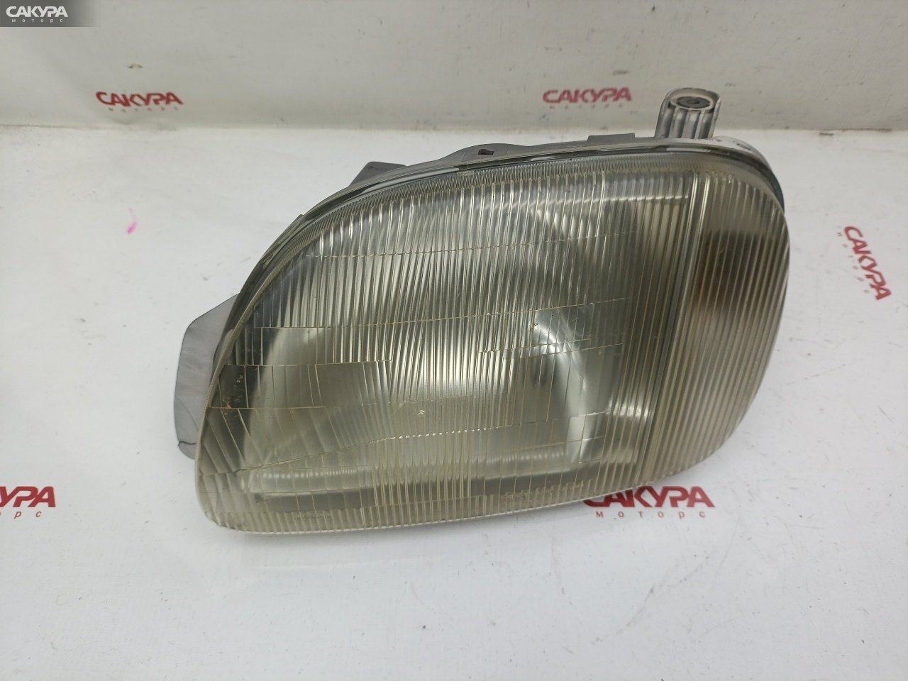 Фара левая Nissan March K11 CG10DE 1562: купить в Сакура Красноярск.
