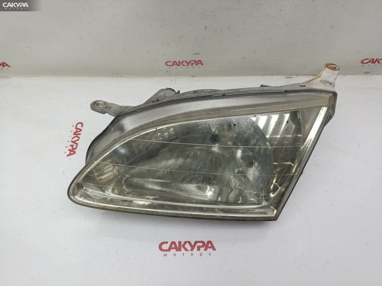 Фара левая Toyota Corolla Spacio AE111N 4A-FE 13-38: купить в Сакура Красноярск.