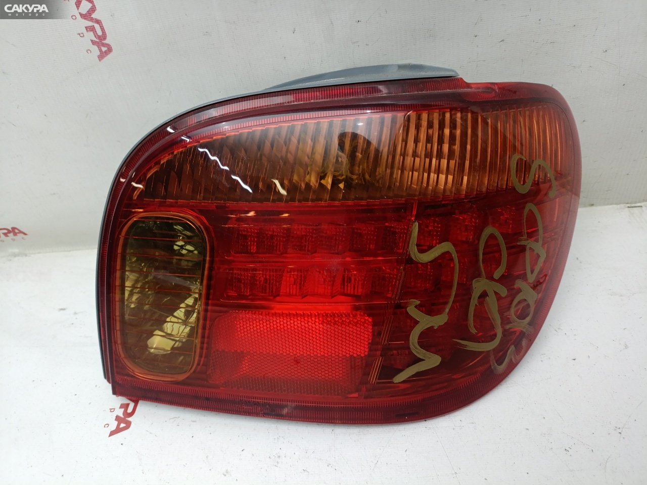 Фонарь стоп-сигнала правый Toyota Vitz SCP13 2SZ-FE 52-106: купить в Сакура Красноярск.