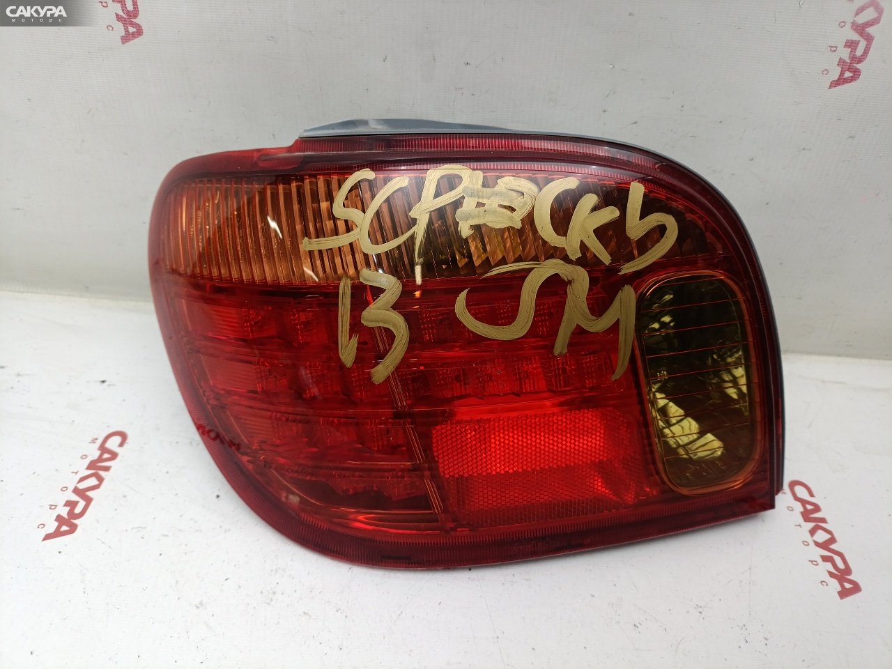 Фонарь стоп-сигнала левый Toyota Vitz SCP13 2SZ-FE 52-106: купить в Сакура Красноярск.
