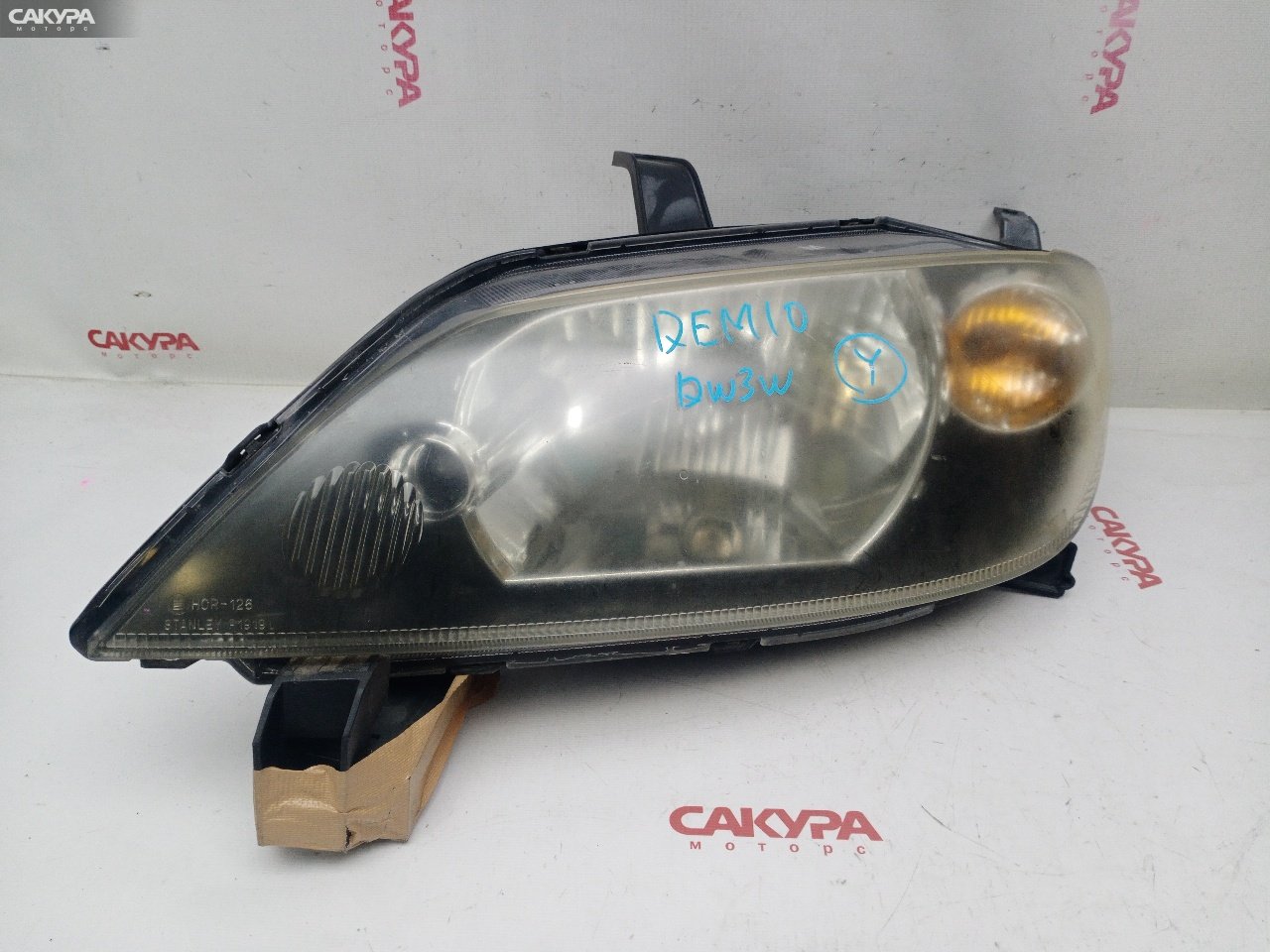 Фара левая Mazda Demio DY3W ZJ-VE P1919: купить в Сакура Красноярск.