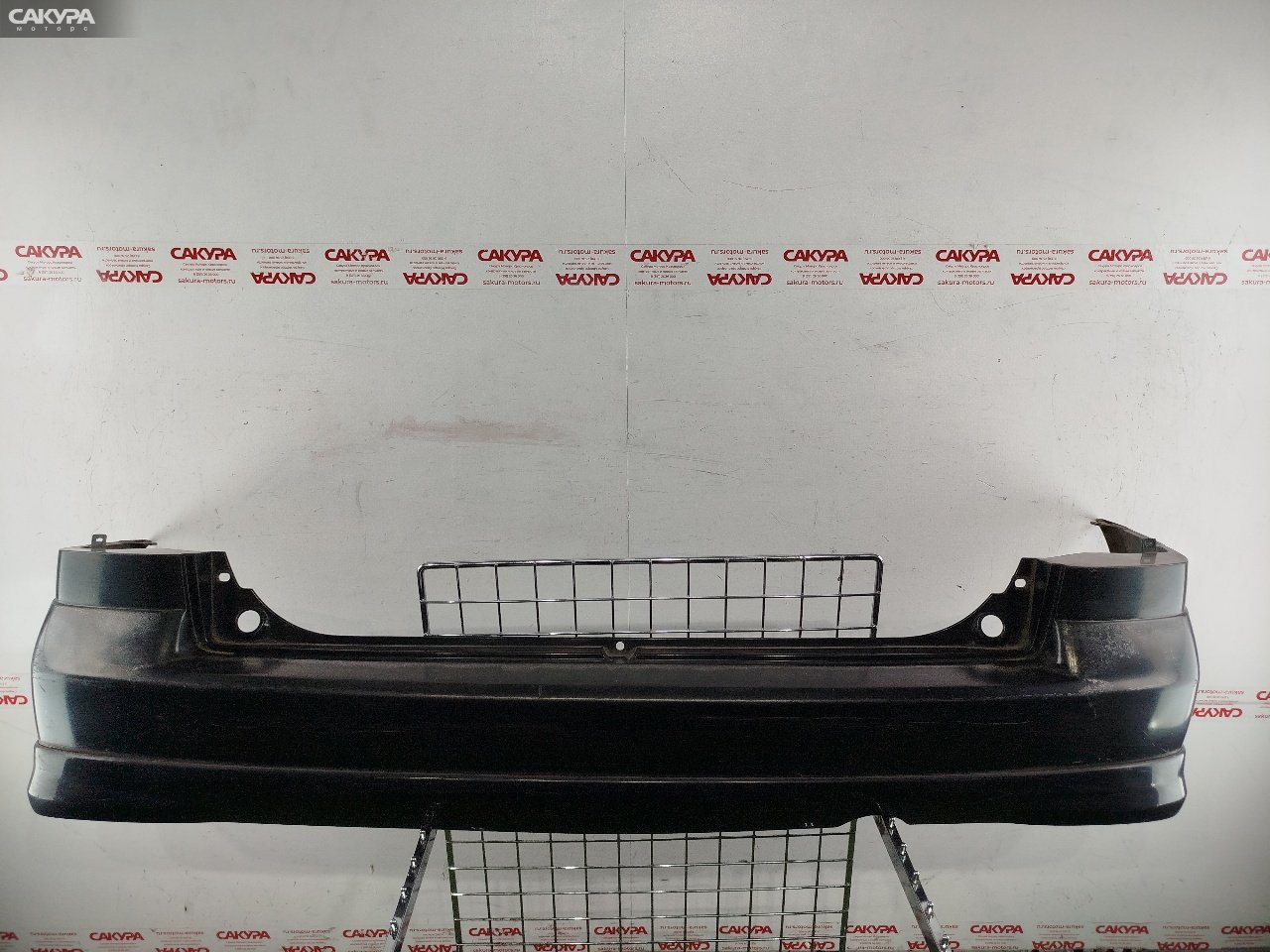 Бампер задний Mazda Demio DW5W B5-E A4H1: купить в Сакура Красноярск.