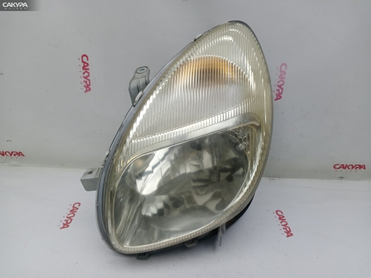 Фара левая Toyota Duet M111A K3-VE2 R7368: купить в Сакура Красноярск.