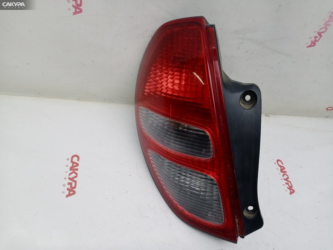 Фонарь стоп-сигнала левый Toyota Duet M111A K3-VE2 220-51677: купить в Сакура Красноярск.