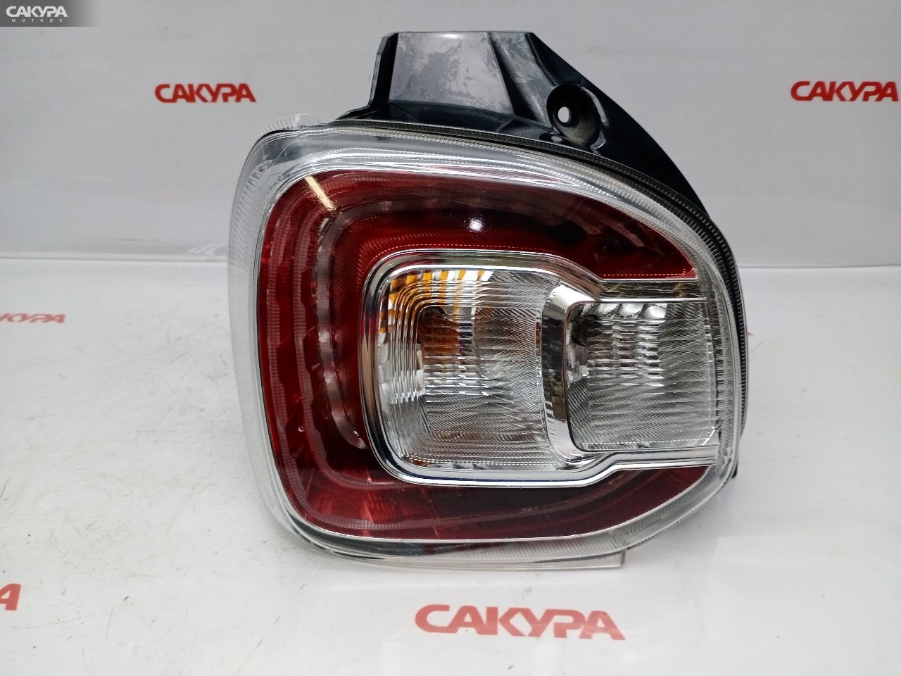 Фонарь стоп-сигнала левый Daihatsu Boon M700S 1KR-FE 220-69028: купить в Сакура Красноярск.