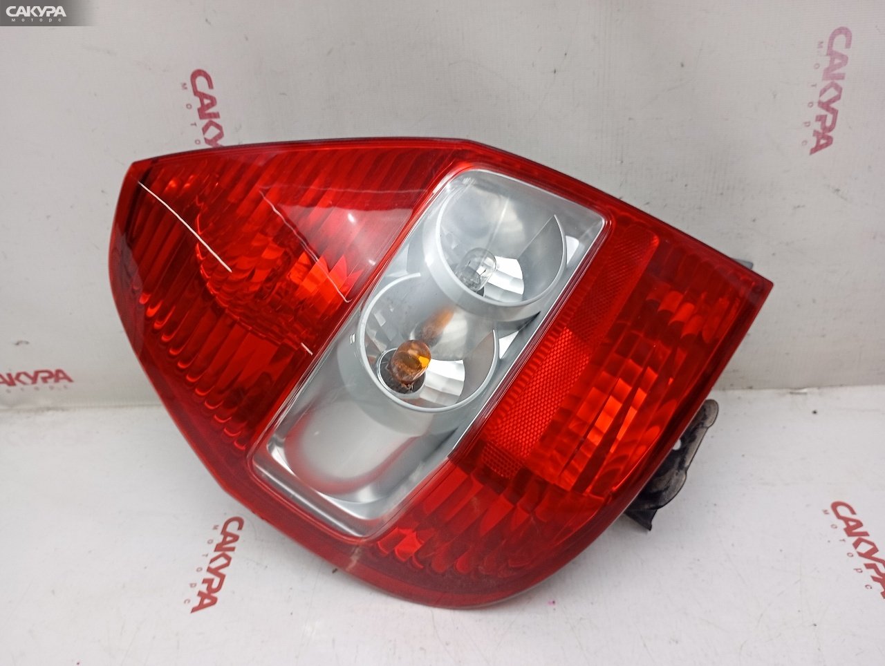 Фонарь стоп-сигнала левый Honda FIT GD1 L13A 4949: купить в Сакура Красноярск.