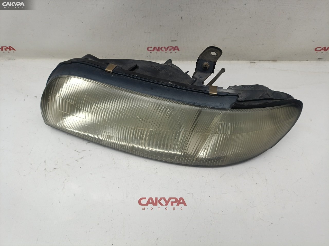 Фара левая Nissan Bluebird EU13 SR18DE 1450: купить в Сакура Красноярск.