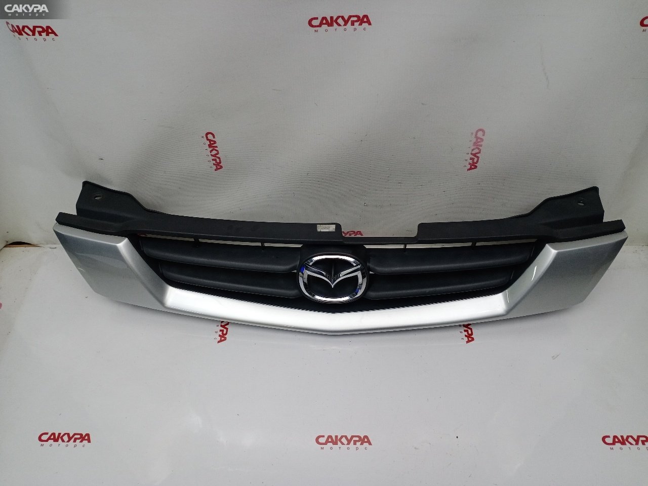Решетка радиатора Mazda Demio DW3W B3E: купить в Сакура Красноярск.