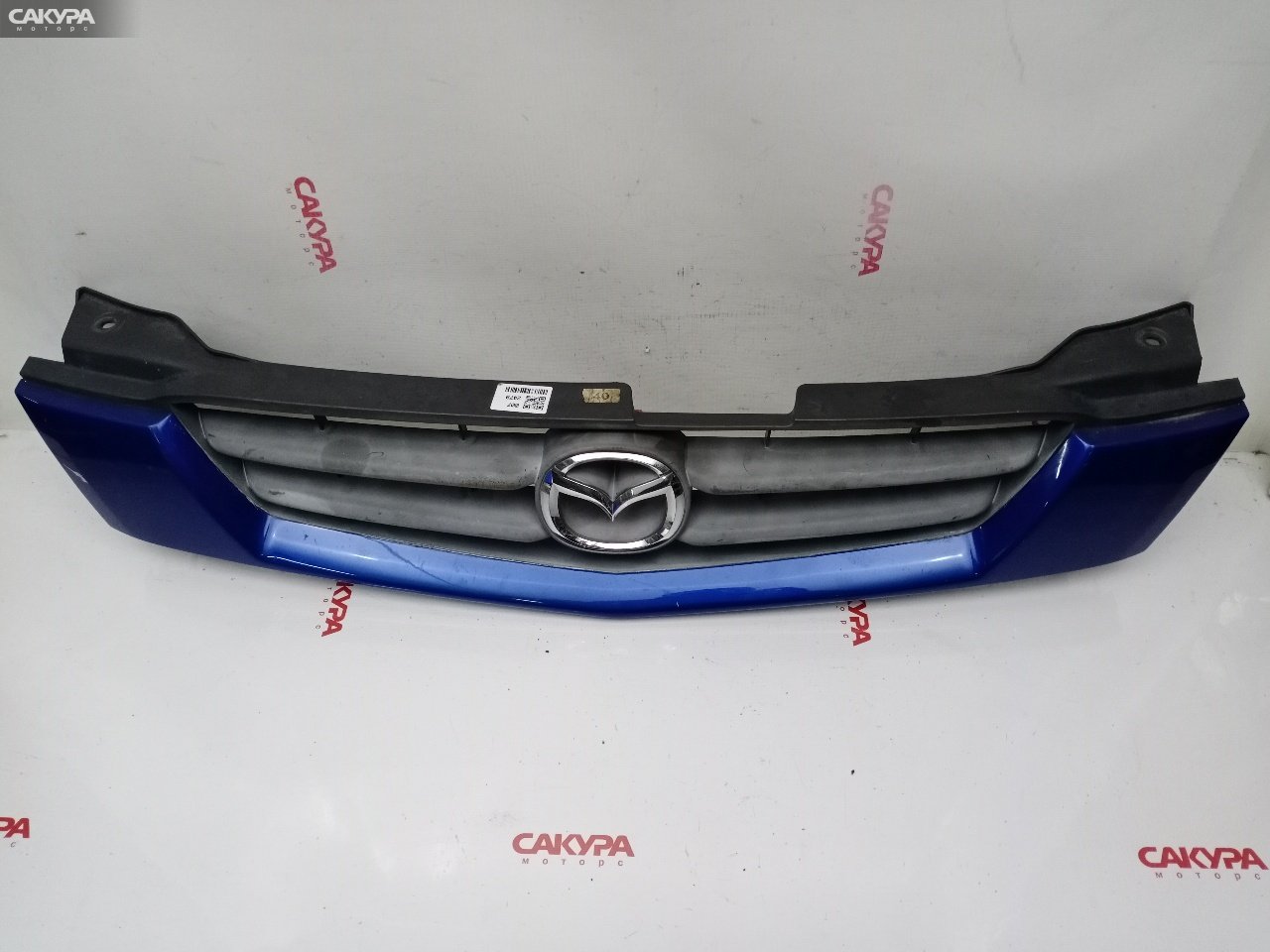 Решетка радиатора Mazda Demio DW3W B3E: купить в Сакура Красноярск.