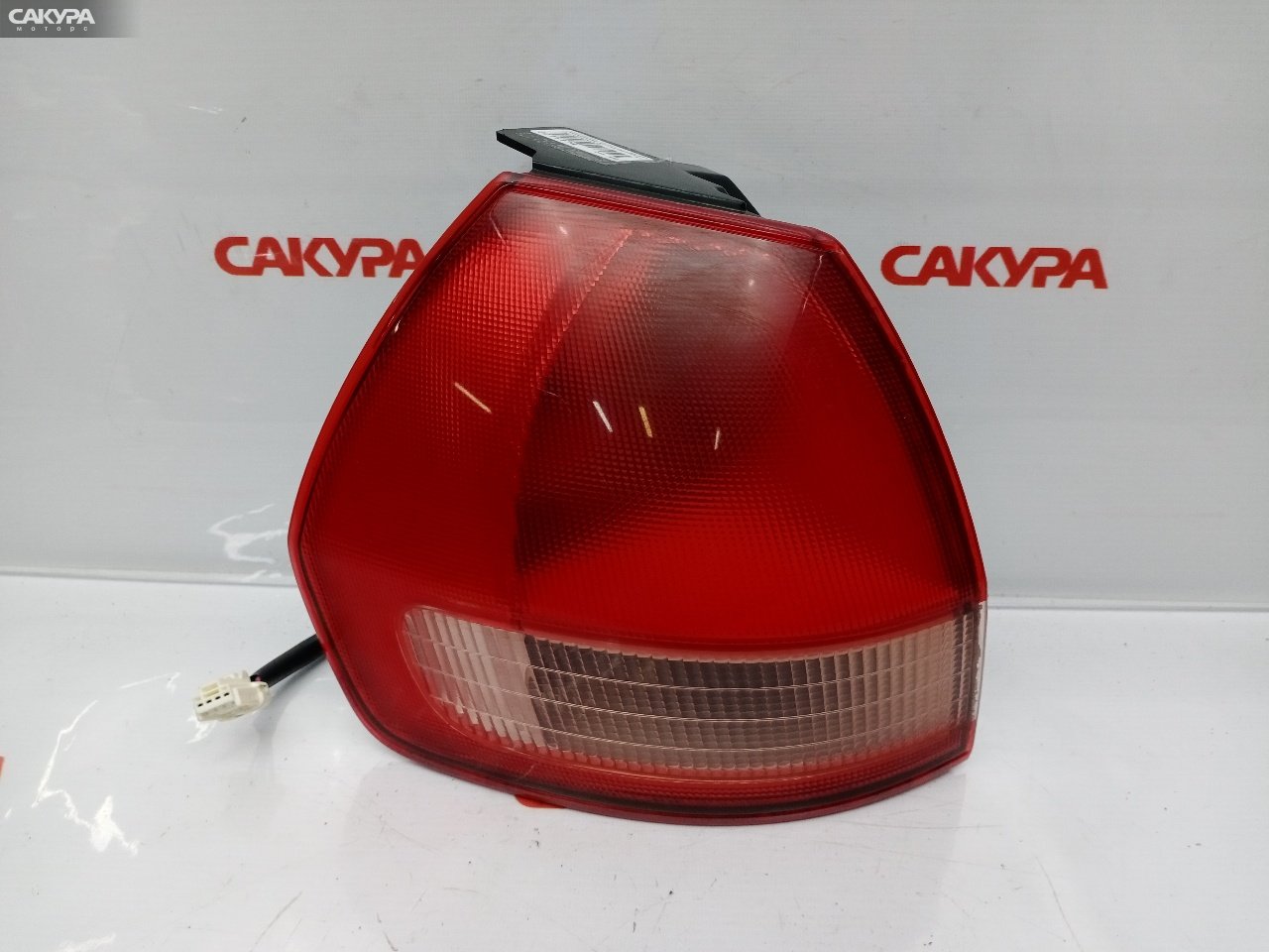 Фонарь стоп-сигнала левый Nissan Wingroad WFY11 QG15DE 220-24824: купить в Сакура Красноярск.