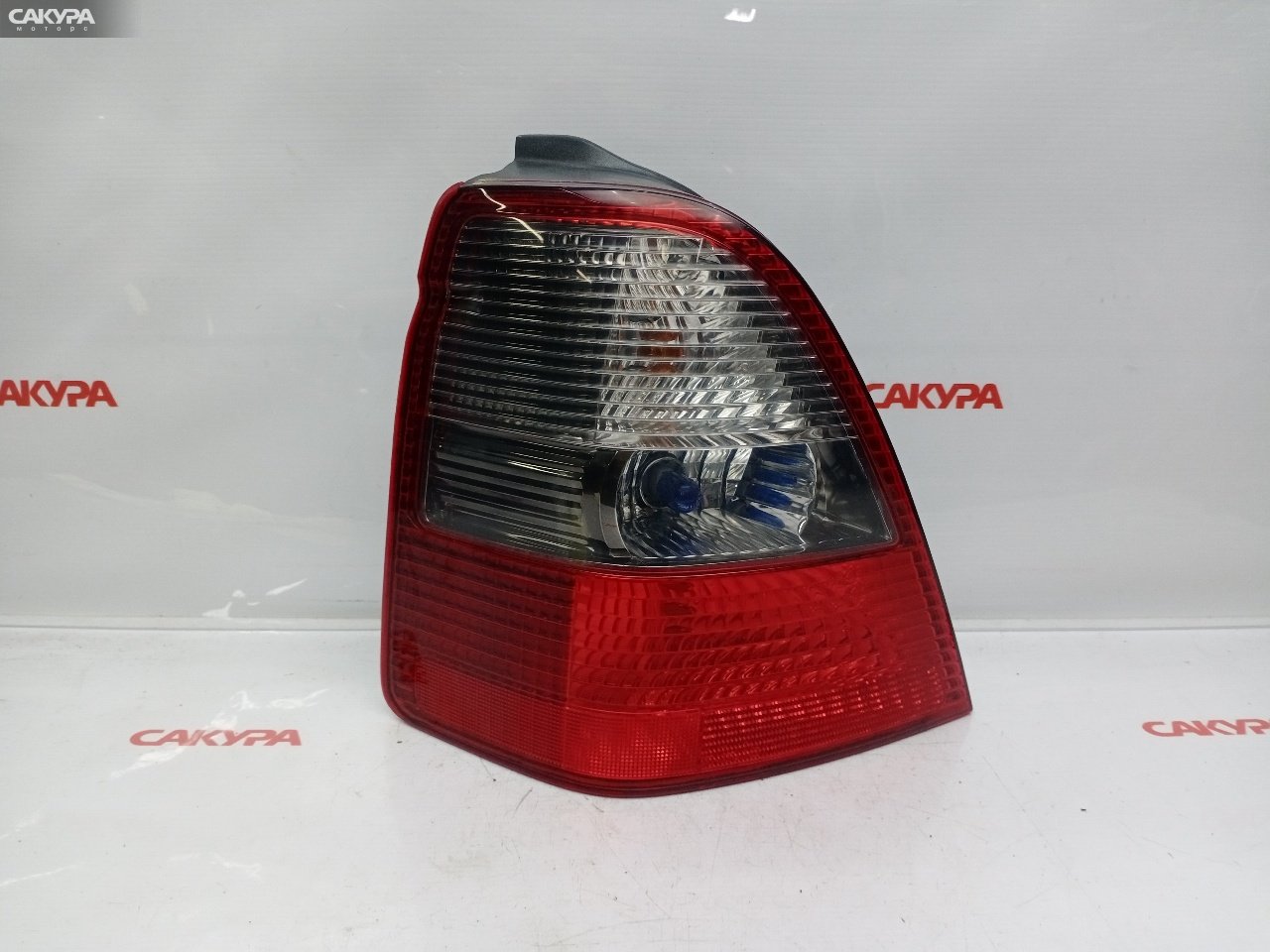 Фонарь стоп-сигнала левый Honda Odyssey RA6 F23A P0711: купить в Сакура Красноярск.