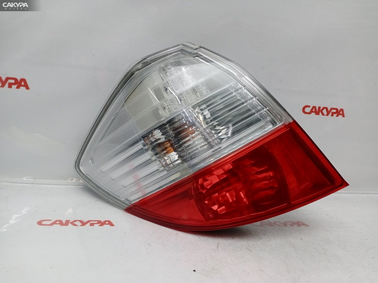 Фонарь стоп-сигнала левый Honda FIT GE8 L15A P7612: купить в Сакура Красноярск.