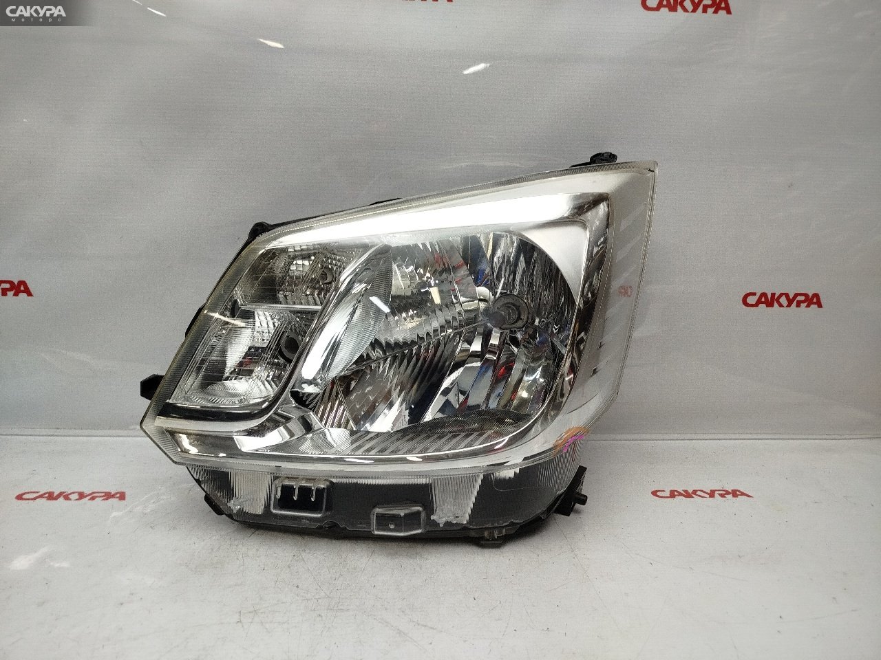 Фара левая Daihatsu Move LA150S KF-VE 19-12: купить в Сакура Красноярск.