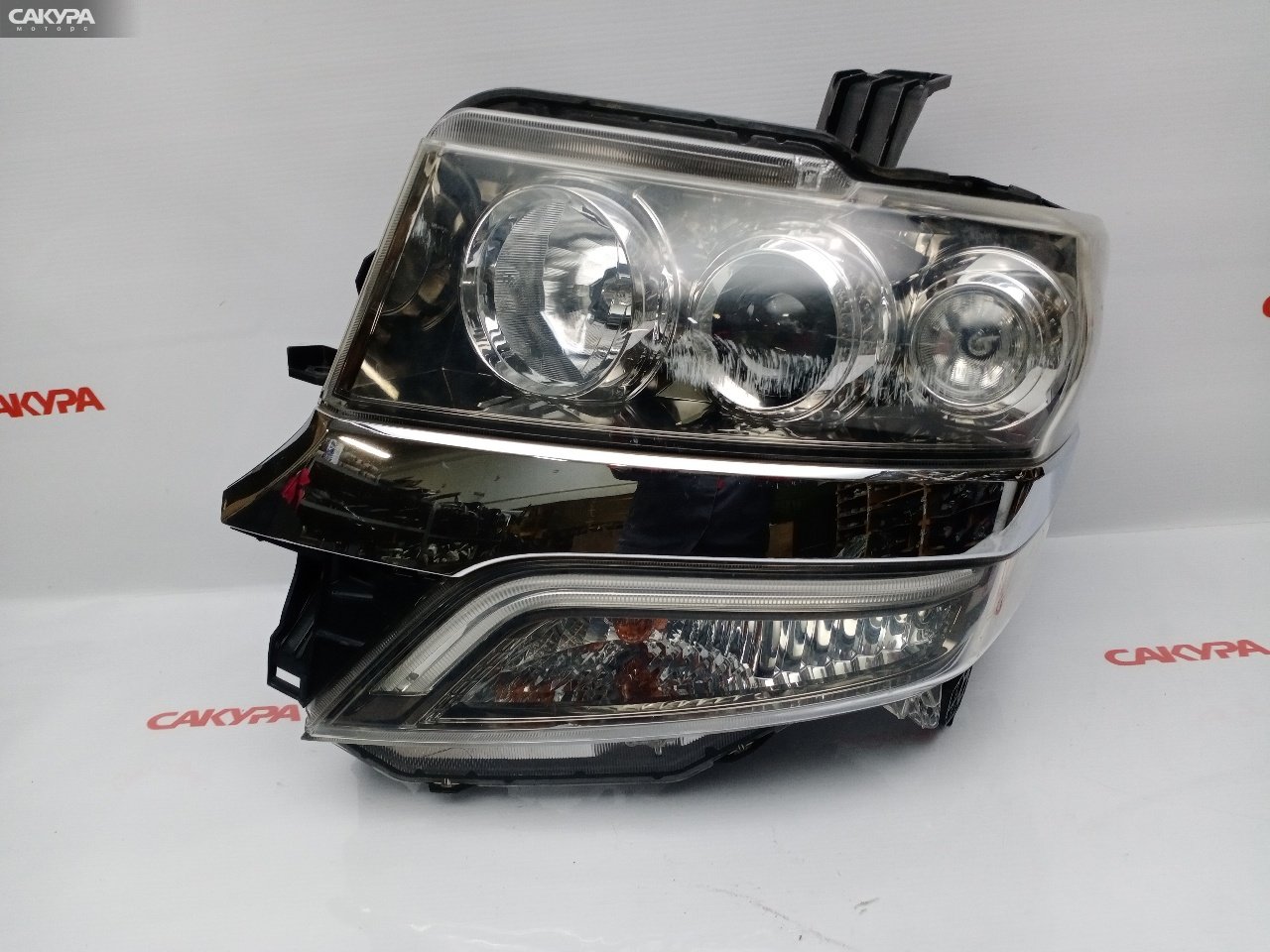Фара левая Honda N-BOX CUSTOM JF1 S07A 100-62038: купить в Сакура Красноярск.