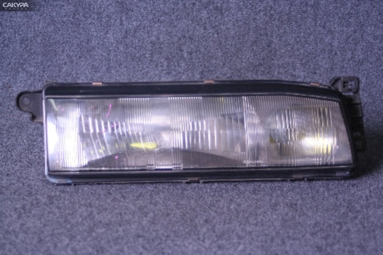 Фара правая Mazda Familia BF5P 100-61246: купить в Сакура Красноярск.