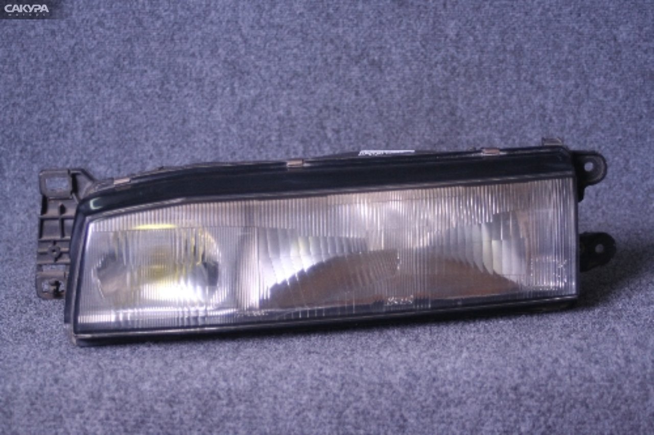 Фара левая Mazda Familia BF5P 100-61246: купить в Сакура Красноярск.
